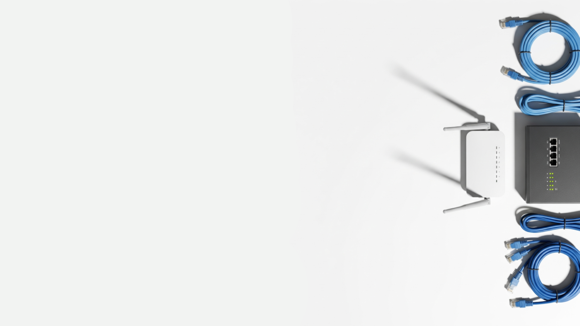 Wireless router with antennas and Ethernet cables on a white background