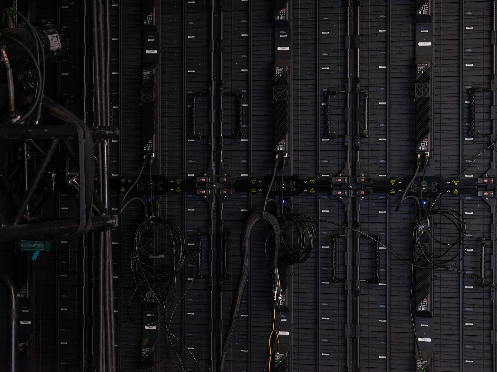 Top-down view of a server rack with multiple servers and cables.