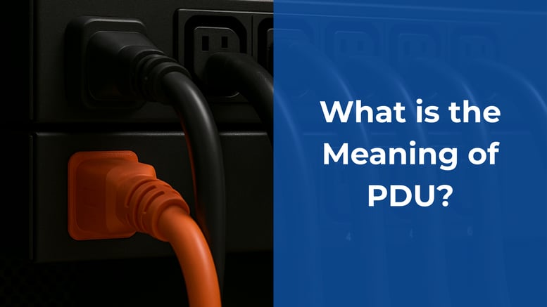Close-up of black and orange power cords plugged into a power distribution unit (PDU), with a blue overlay displaying the text: 'What is the Meaning of PDU?'
